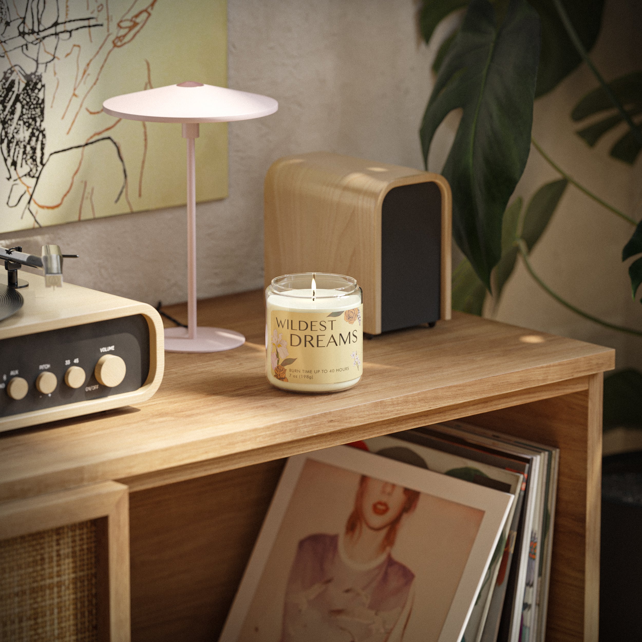 Wildest Dream Jar Candle sitting on a bookshelf with vinyl records